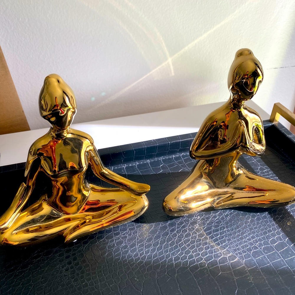 Gold yoga figures